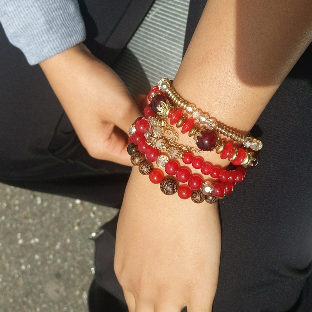 5 red and gold beaded bracelets